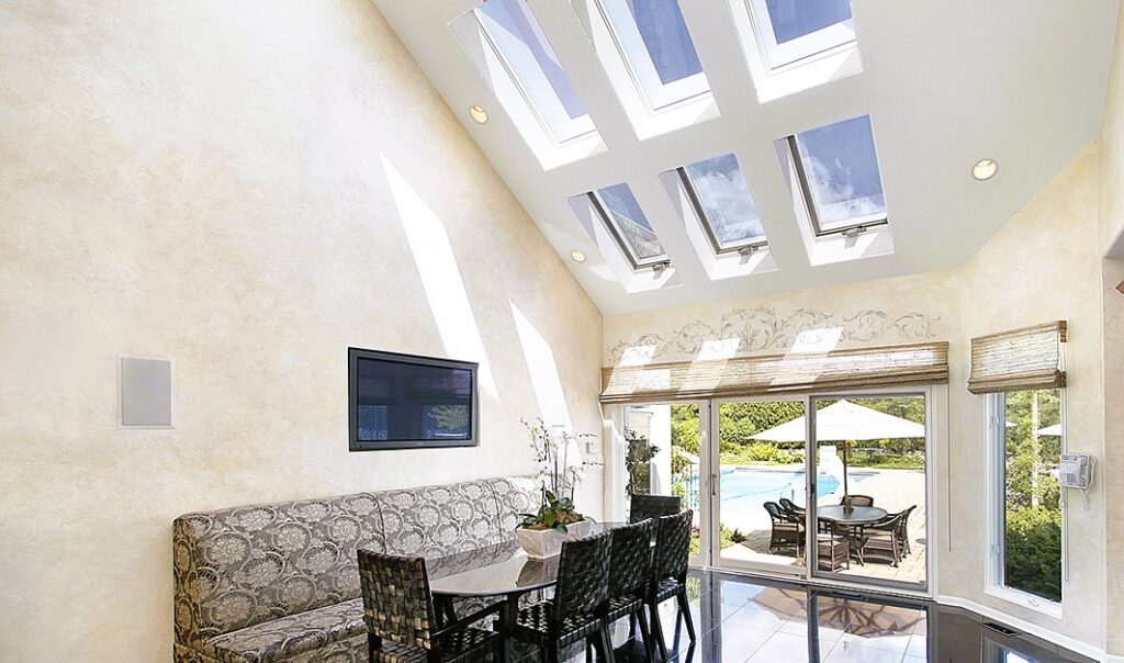 The combination in the interior of panoramic windows and skylights