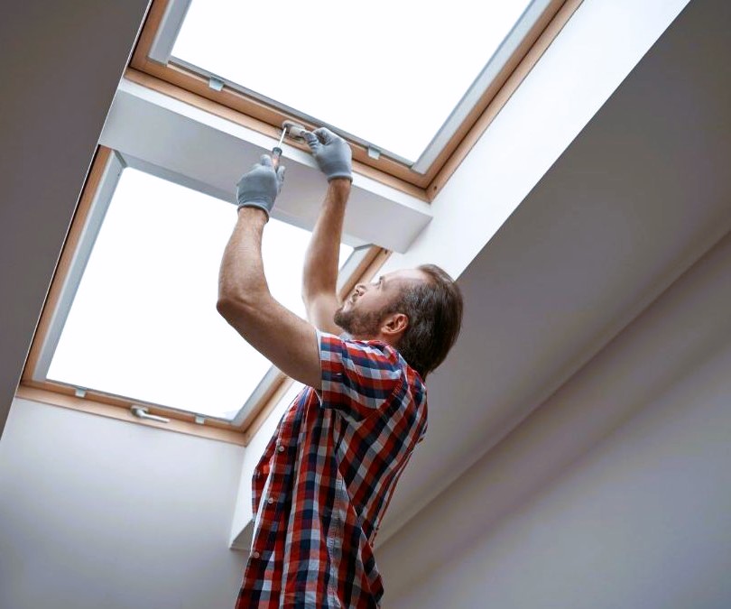 Man screwing up a window